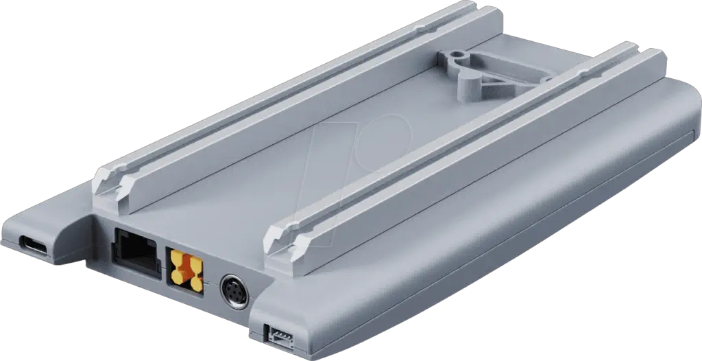 Unitree Go2 docking station perspective view showing the grey housing with mounting rails on top and the port end with USB-C, gigabit Ethernet, power connector and M8 aviation plug